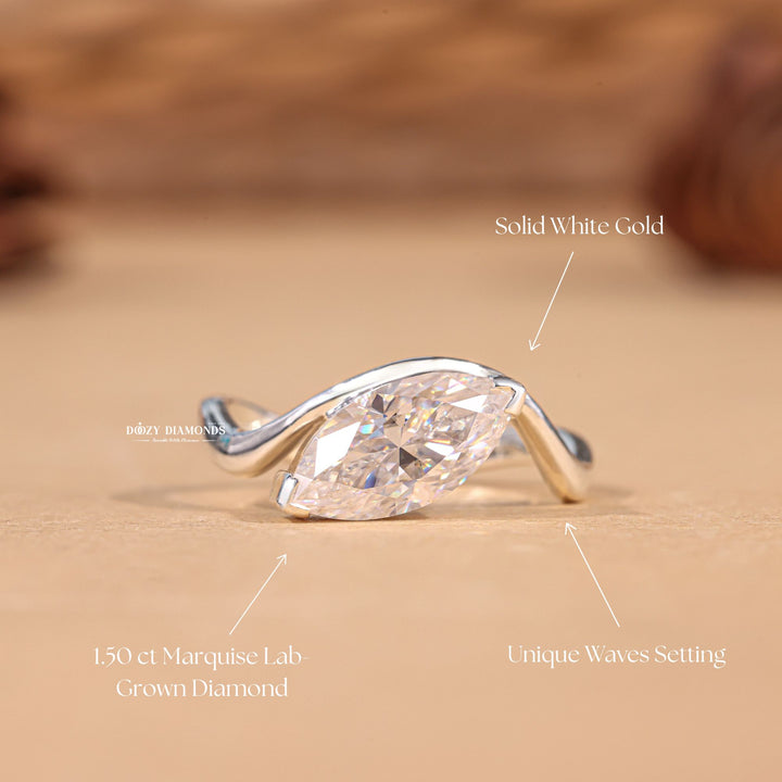 Marquise solitaire diamond ring displayed on jewelry stand