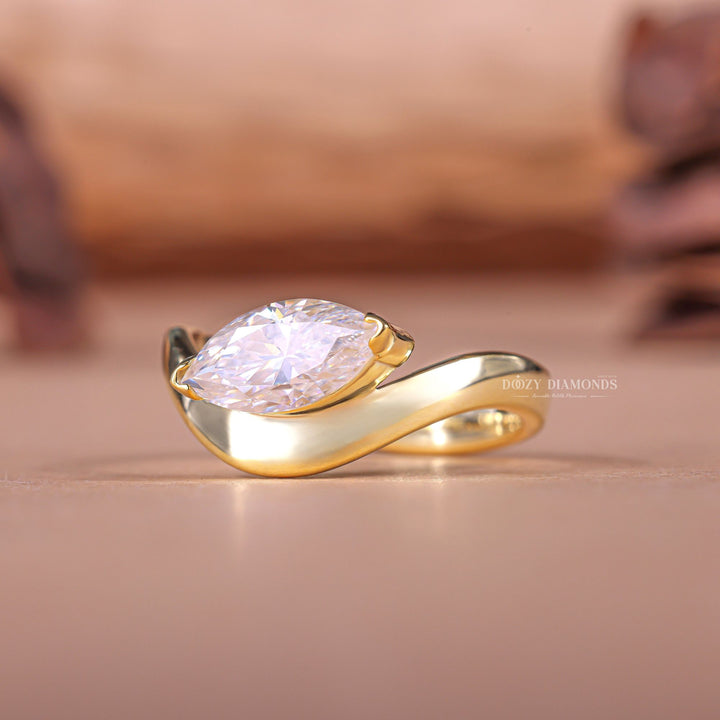 Marquise solitaire engagement ring close-up showing F/VS1 diamond clarity