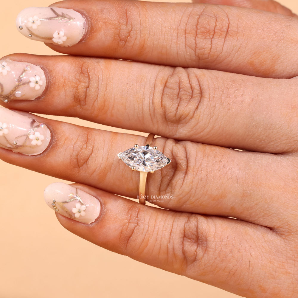 Side angle of marquise solitaire diamond engagement ring