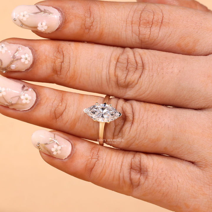 Side angle of marquise solitaire diamond engagement ring