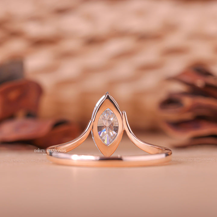 Marquise cut engagement ring shown with authenticity certificate