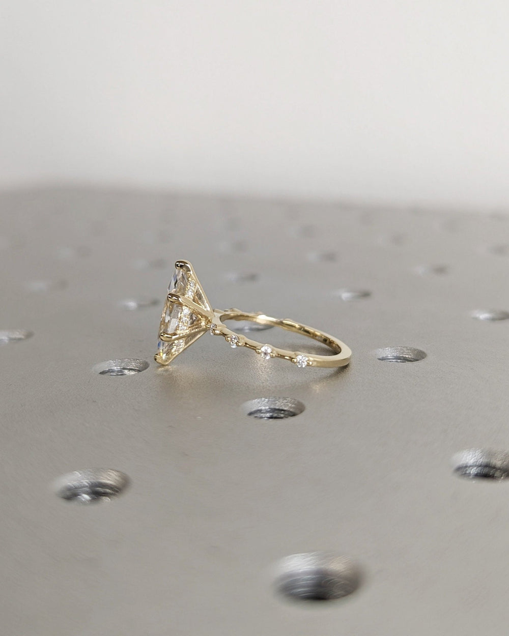 Unboxing view of marquise cut hidden halo diamond engagement ring