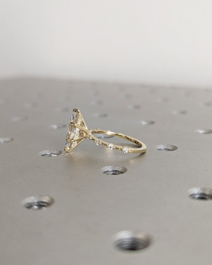 Unboxing view of marquise cut hidden halo diamond engagement ring