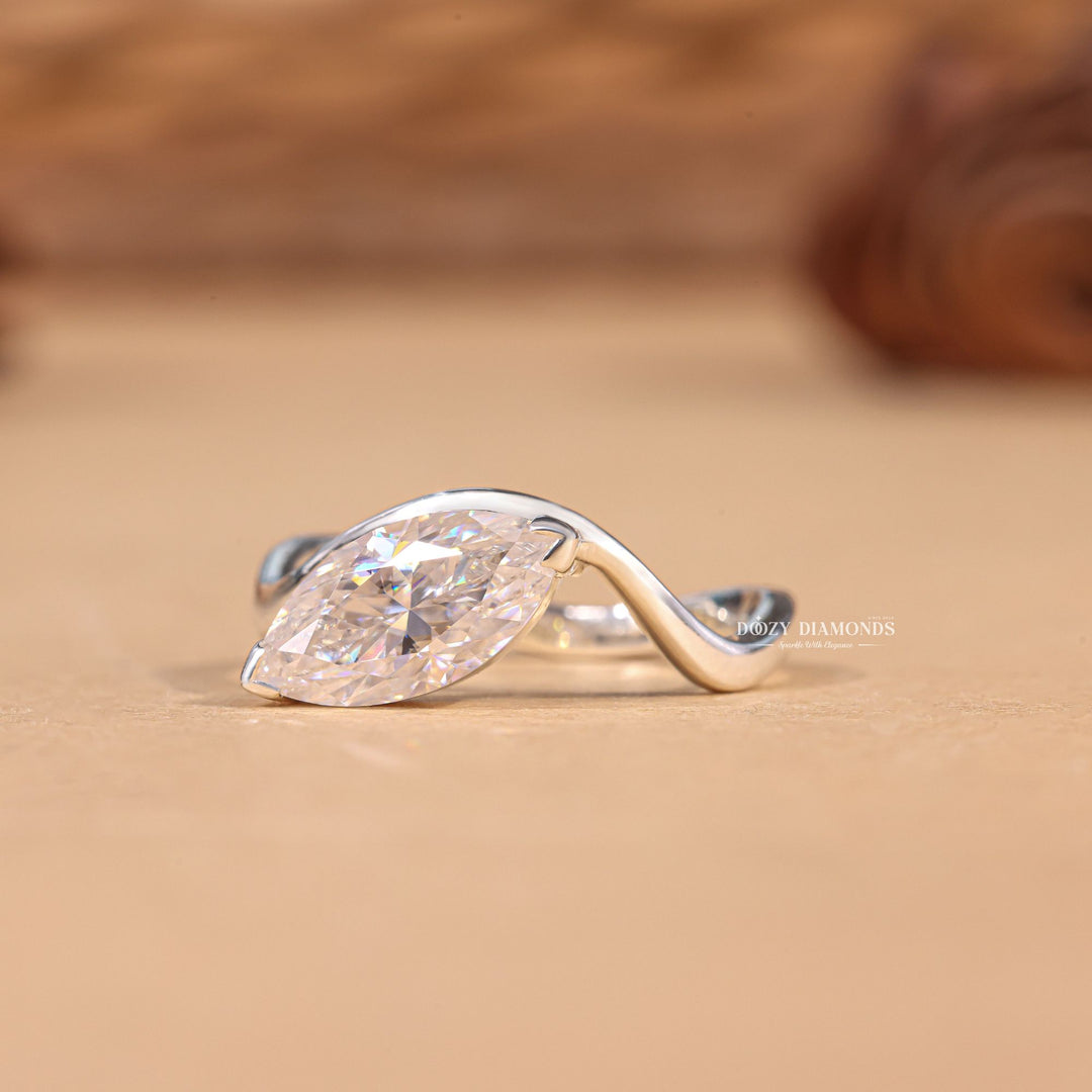 Marquise solitaire engagement ring photographed in natural light