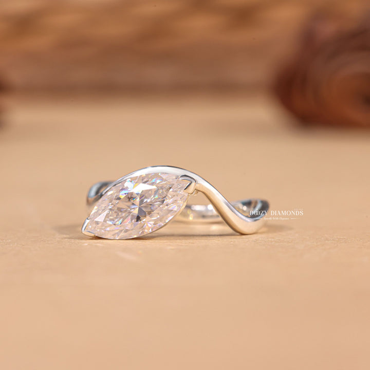 Marquise solitaire engagement ring photographed in natural light