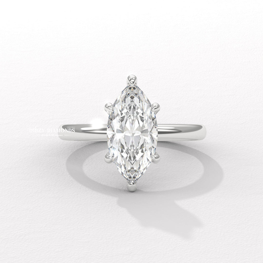 Certified marquise cut diamond featured in hidden halo engagement ring