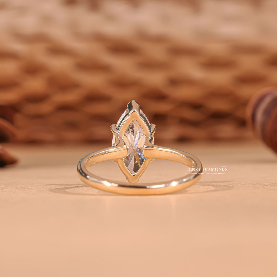 Marquise cut solitaire engagement ring shown in real-life wear