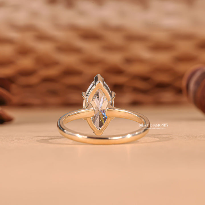 Marquise cut solitaire engagement ring shown in real-life wear