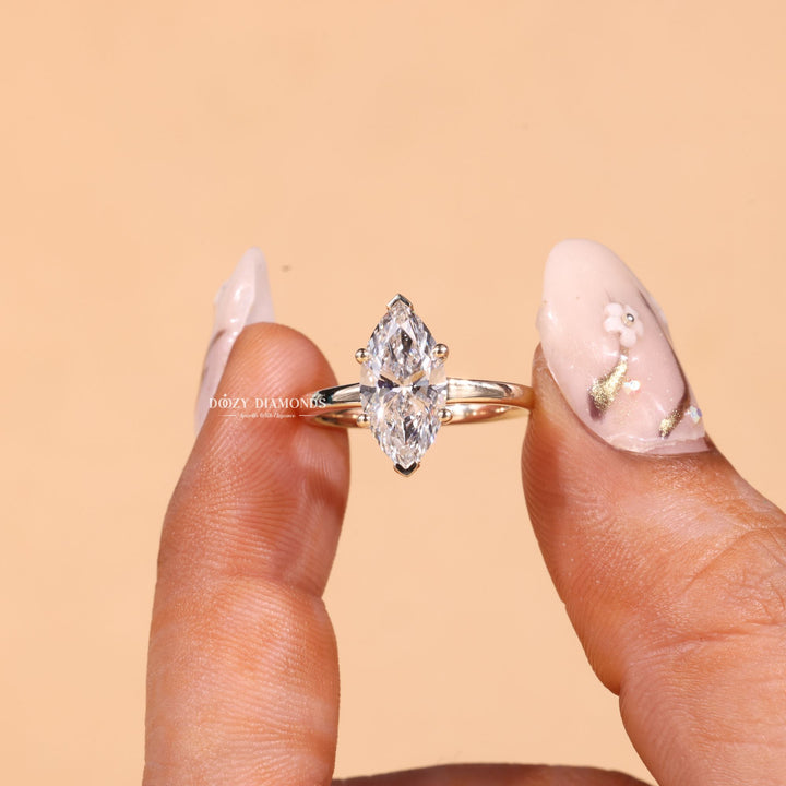 Marquise cut diamond ring worn on hand