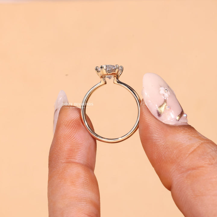 Marquise solitaire engagement ring viewed from the side