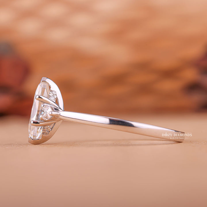 Premium marquise cut three stone engagement ring crafted in solid gold