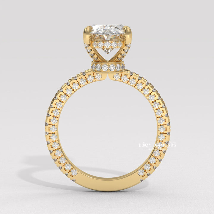 Detailed close-up of oval pave diamond engagement ring