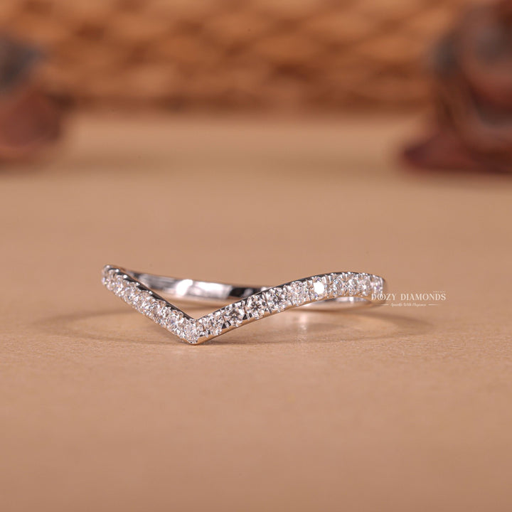 Curved Eternity diamond band stacked with engagement ring