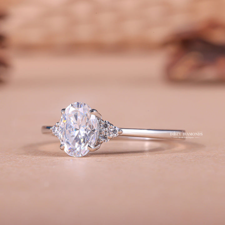 IGI certified oval cut diamond in cluster engagement ring setting