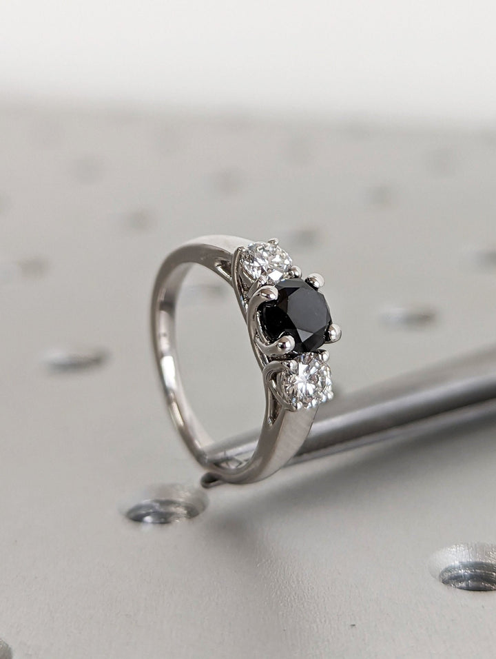 Round cut diamond ring worn on hand