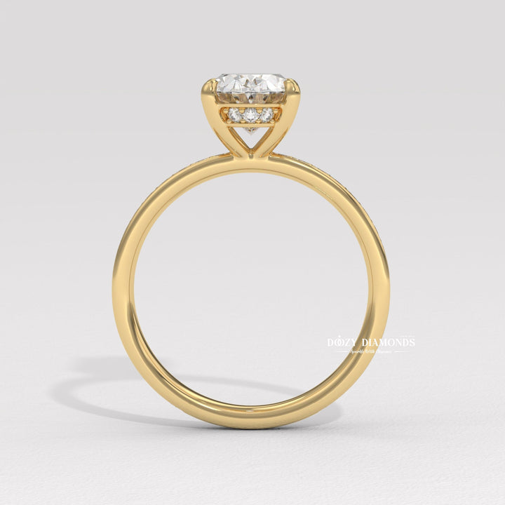 Close-up of oval cut center diamond in solitaire engagement ring