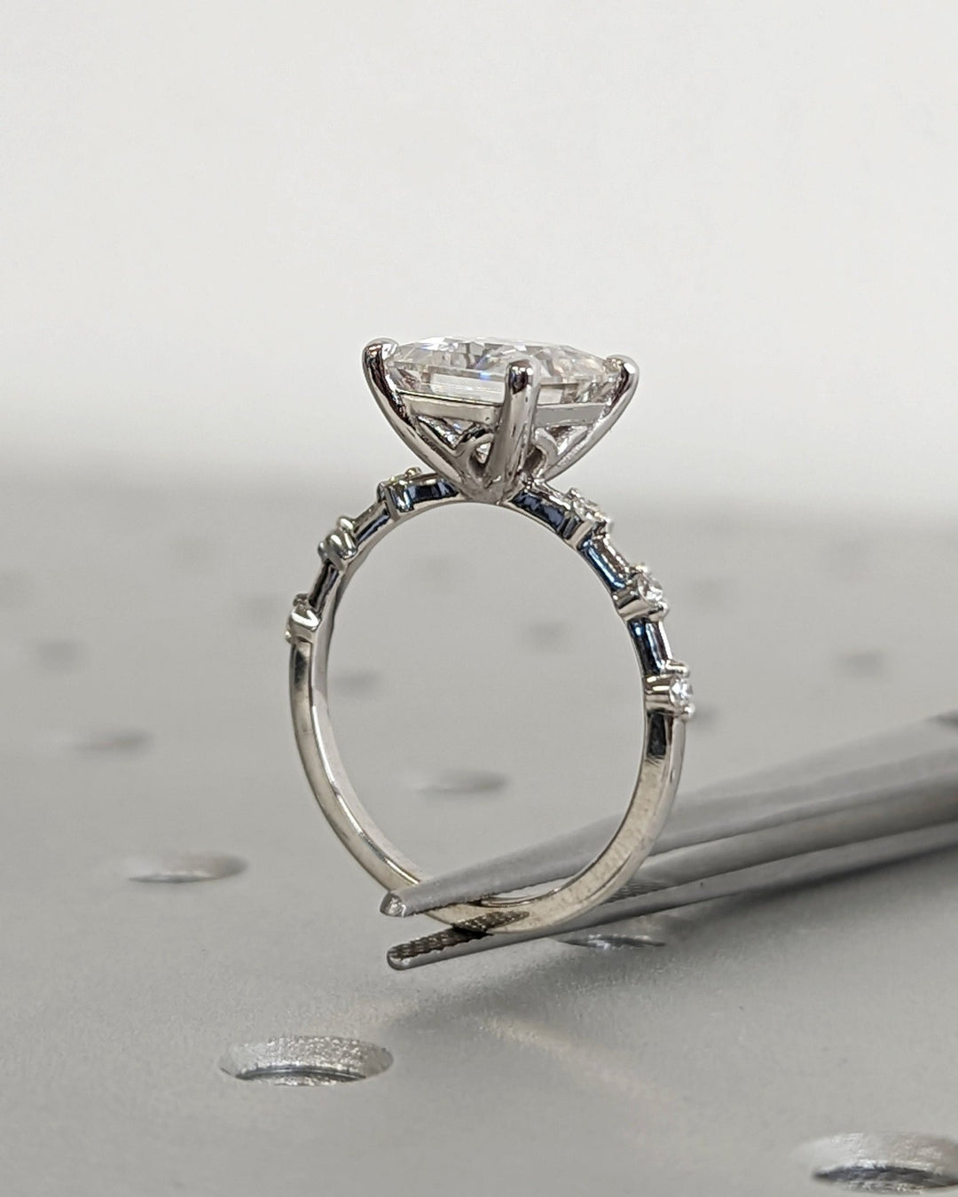 Certified princess cut diamond featured in pave engagement ring