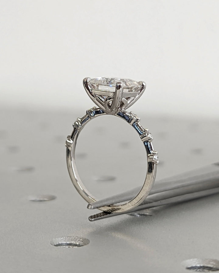 Certified princess cut diamond featured in pave engagement ring
