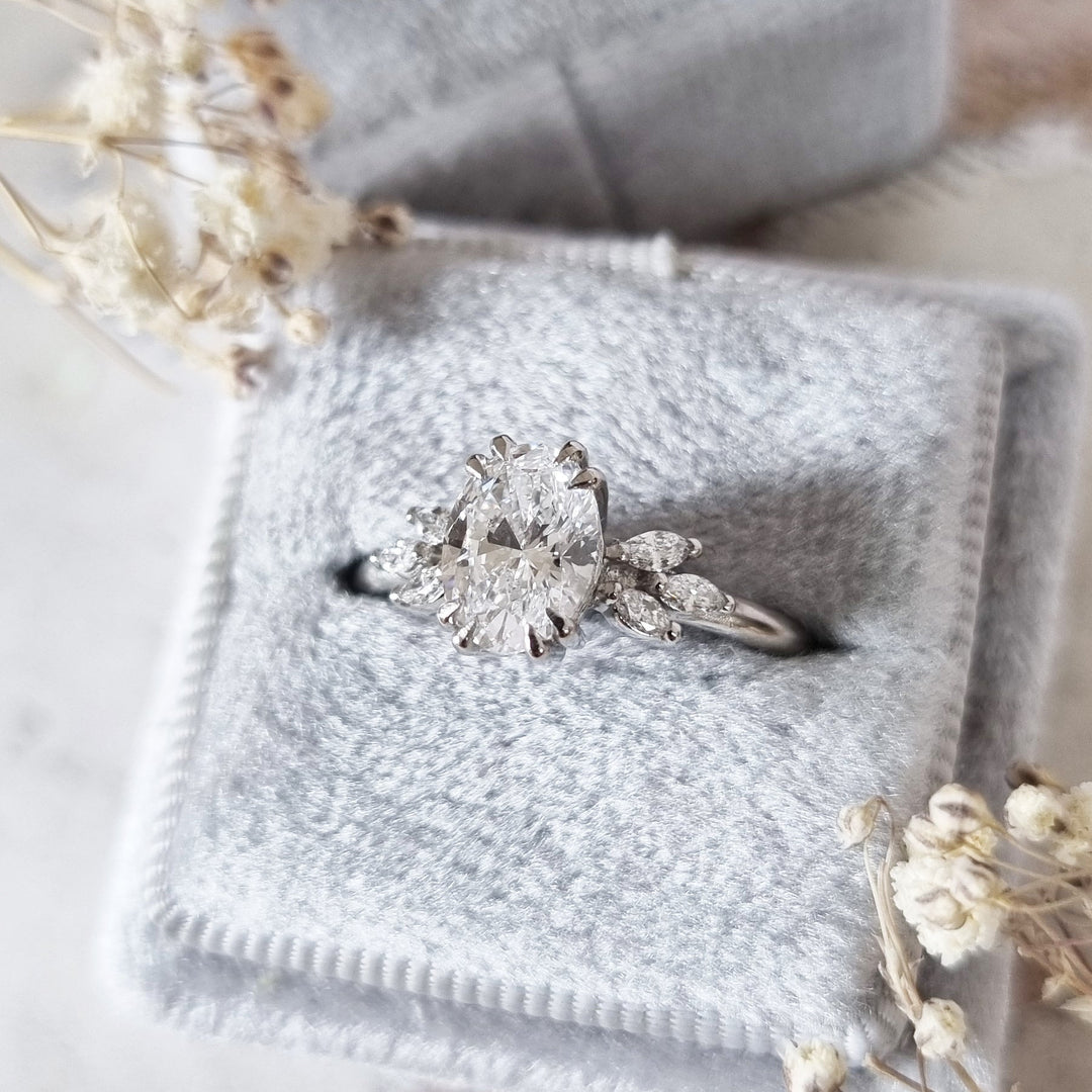 Certified oval cut diamond featured in art deco engagement ring