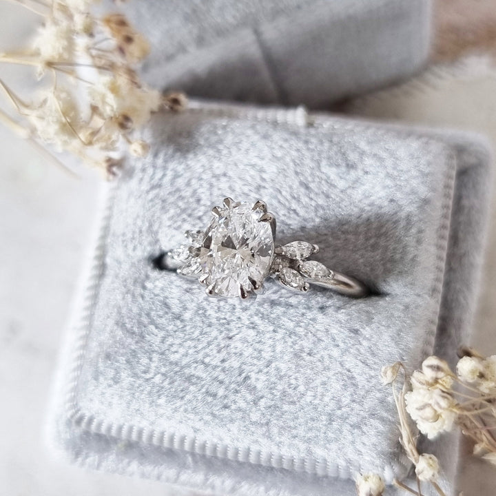 Certified oval cut diamond featured in art deco engagement ring