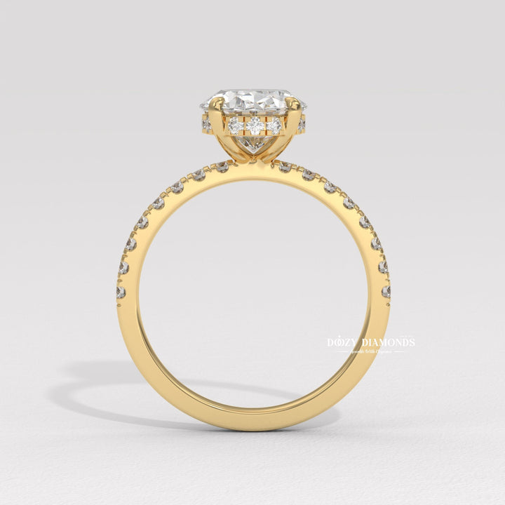 Oval hidden halo engagement ring close-up showing high clarity diamond clarity