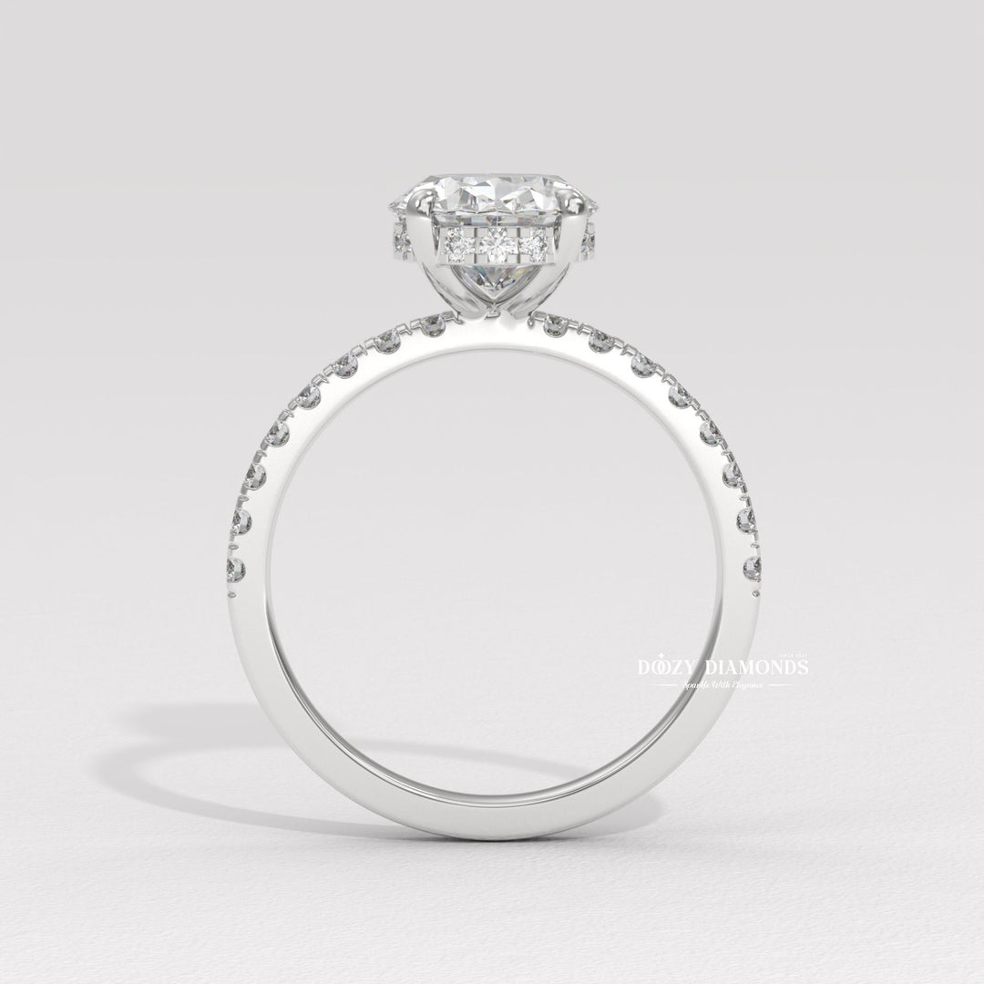 Detailed close-up of oval hidden halo diamond engagement ring