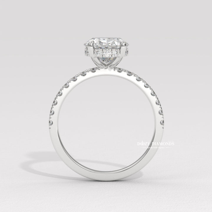 Detailed close-up of oval hidden halo diamond engagement ring
