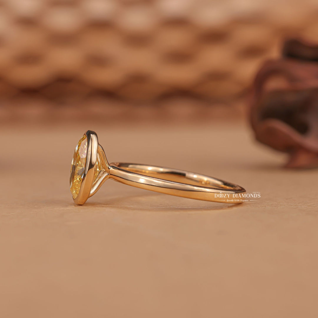 Oval cut diamond ring worn on hand