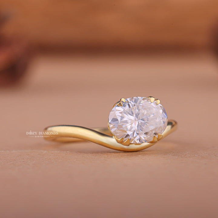 Oval east west engagement ring close-up showing F/VS1 diamond clarity