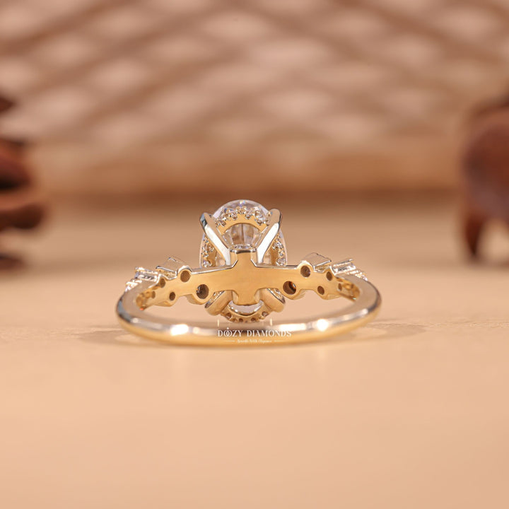 Close-up of oval cut center diamond in pave engagement ring