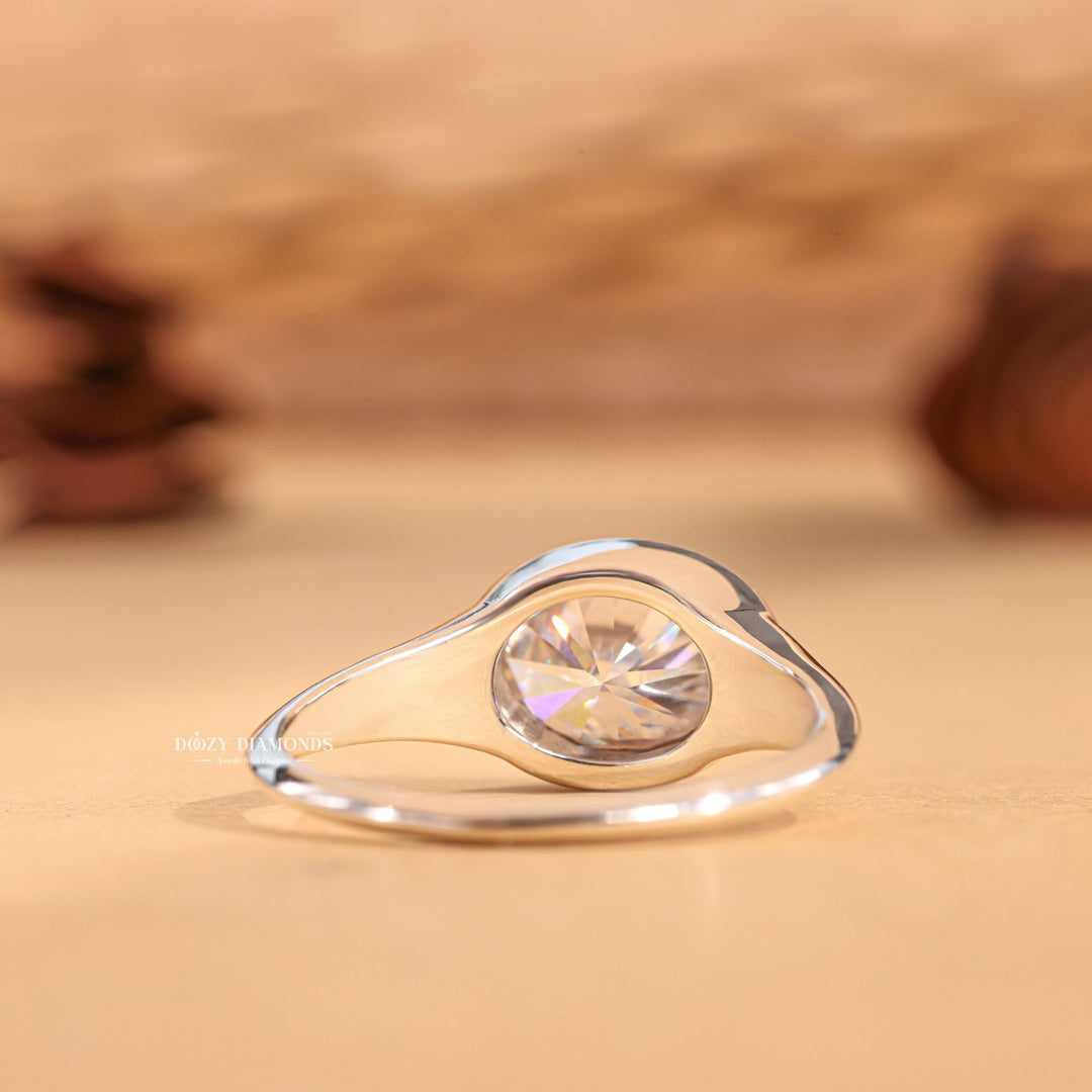 Oval east west lab grown diamond ring fitted on finger