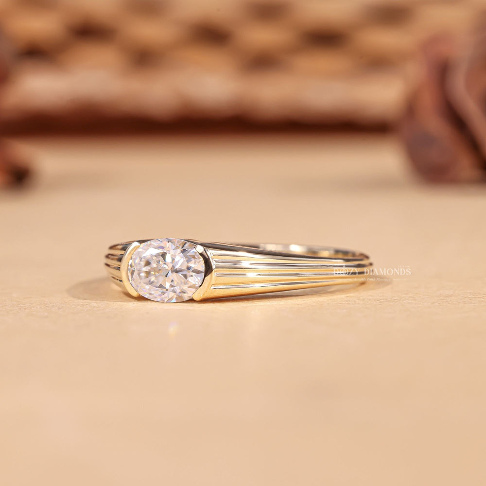 Oval cut east west engagement ring shown in real-life wear