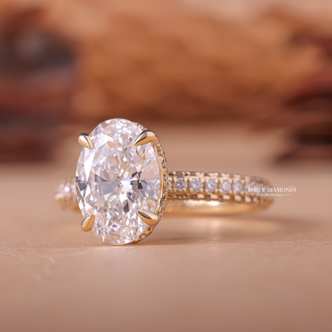 Angled view of oval cut diamond in hidden halo setting