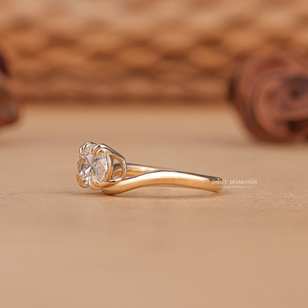 Oval solitaire engagement ring viewed from the side