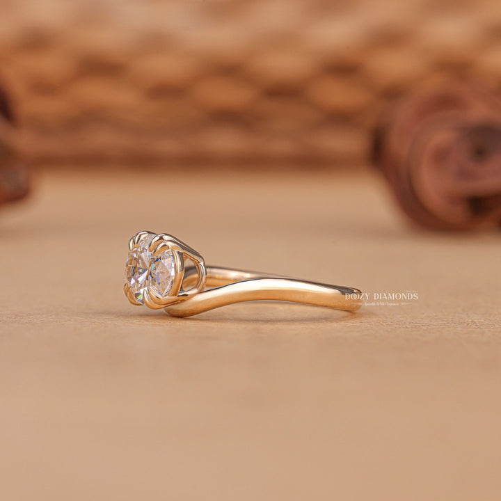 Oval solitaire engagement ring viewed from the side