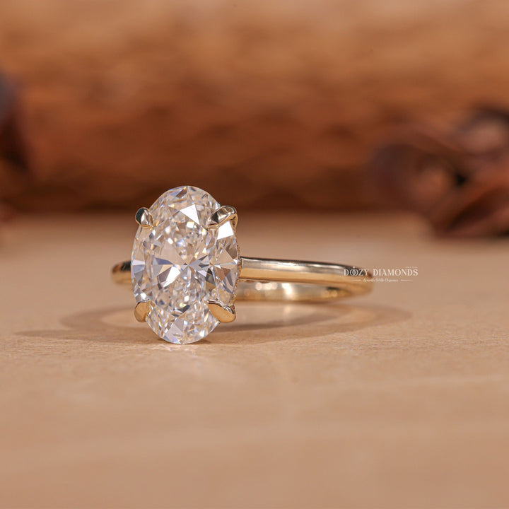 Macro shot of oval cut diamond facets in hidden halo ring setting