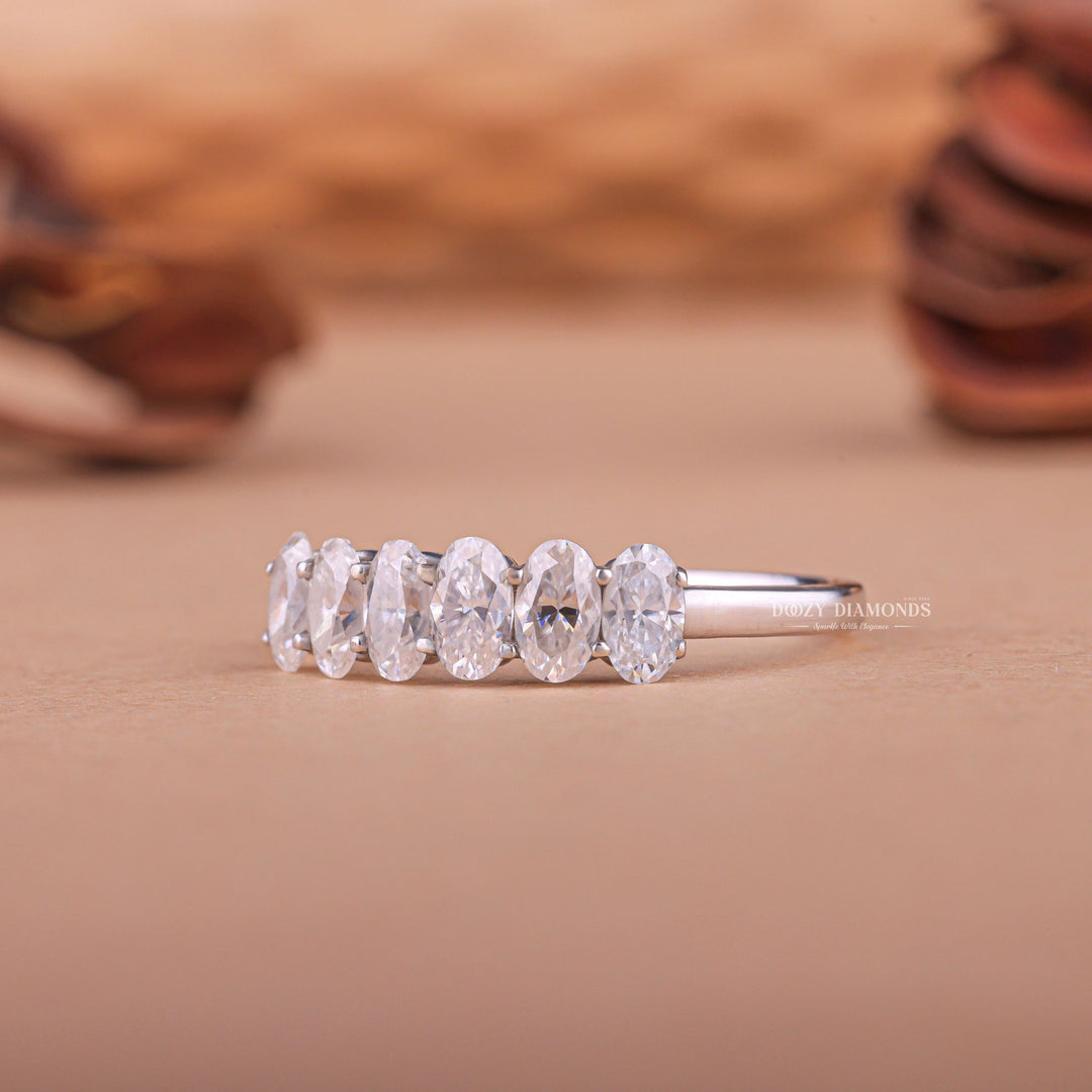 Oval diamond band stacked with engagement ring