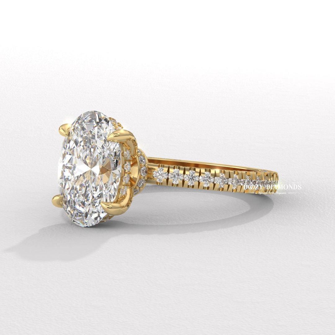 Macro shot of oval cut diamond facets in pave ring setting