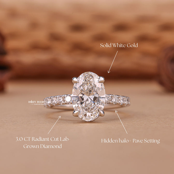 Profile view of oval cut hidden halo engagement ring band