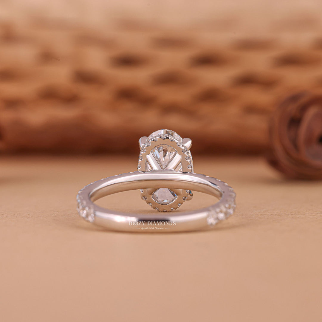 Side angle of oval hidden halo diamond engagement ring