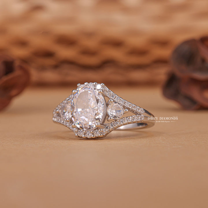 Oval three stone engagement ring close-up highlighting diamond sparkle