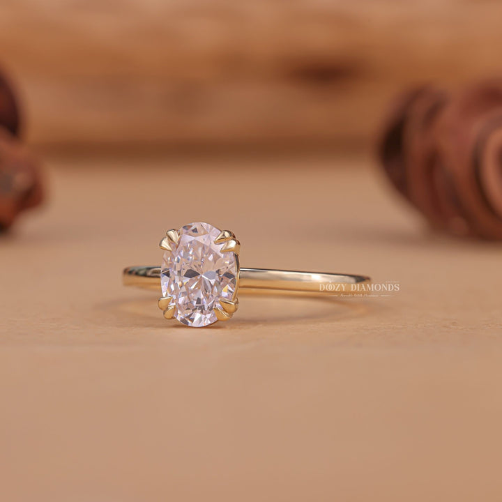 Close-up of oval cut center diamond in solitaire engagement ring