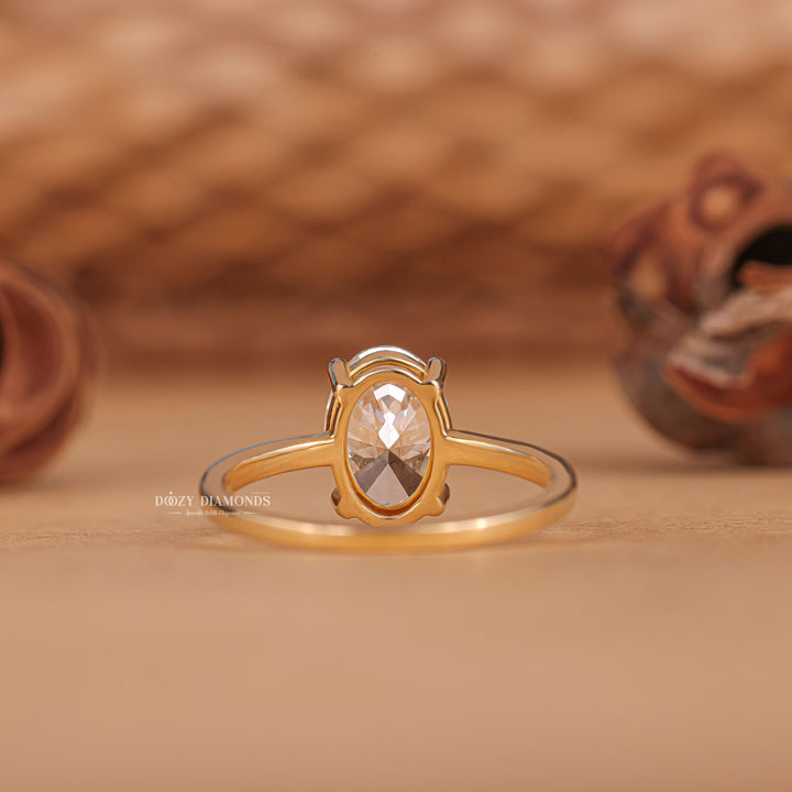 Detailed close-up of oval solitaire diamond engagement ring