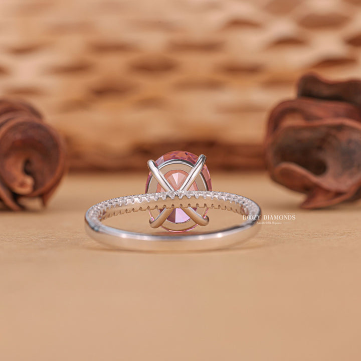 Oval pave engagement ring close-up highlighting diamond sparkle