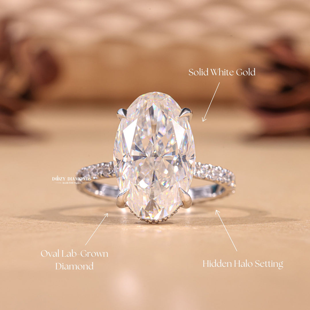 Oval hidden halo engagement ring photographed in natural light