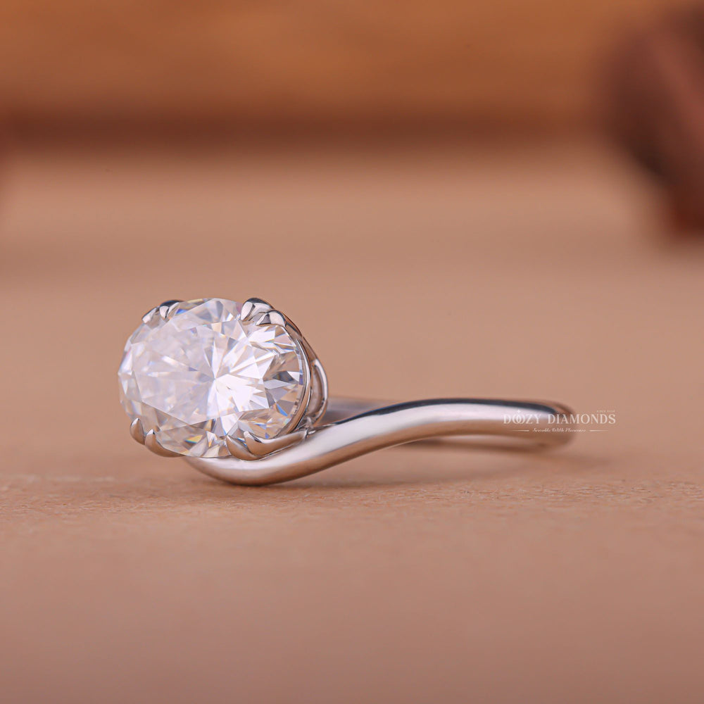 Side angle of oval east west diamond engagement ring
