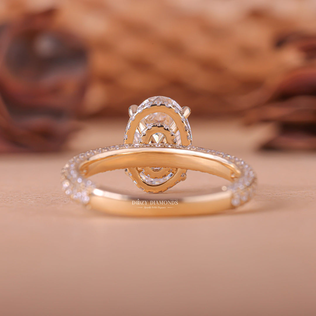 Oval hidden halo diamond ring displayed on jewelry stand