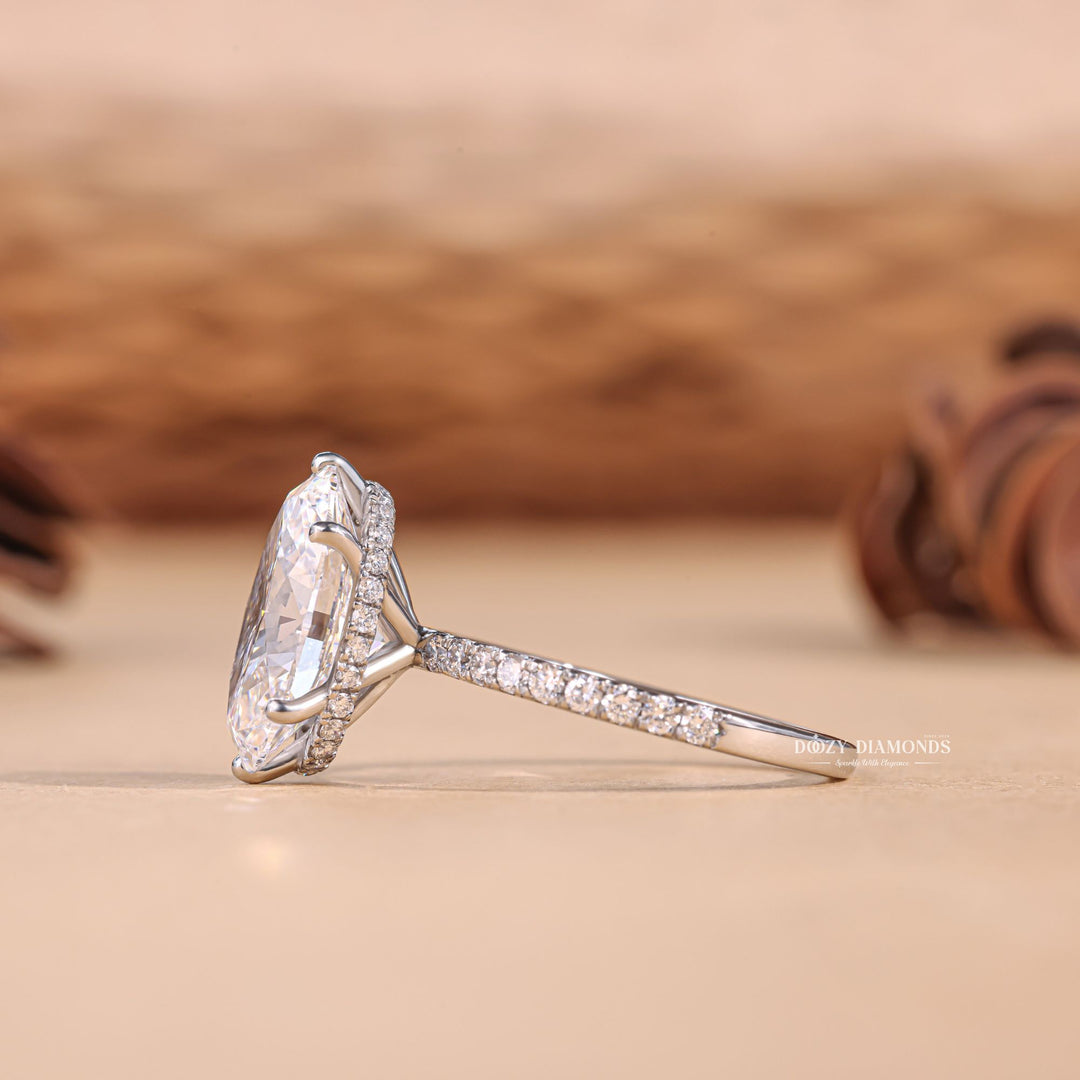 Oval hidden halo engagement ring close-up highlighting diamond sparkle