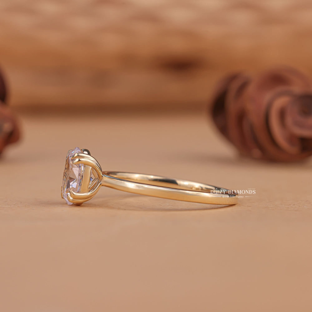 Oval solitaire engagement ring close-up highlighting diamond sparkle