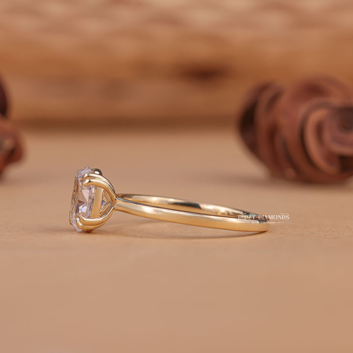 Oval solitaire engagement ring close-up highlighting diamond sparkle
